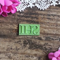 Stempel napis "IHS" 